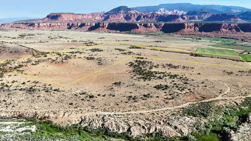 Overview of rural landscape featuring mountains and property parcel outlined