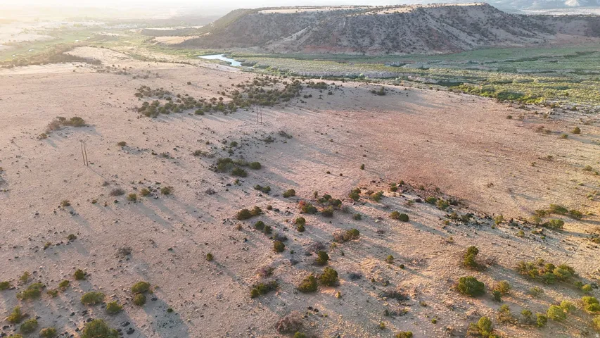 View of mountain backdrop featuring a desert landscape and rural landscape