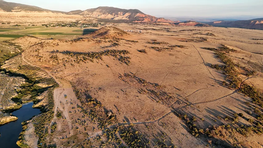 Overview of rural landscape with a mountain backdrop and a desert landscape