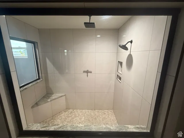 Bathroom with tiled shower