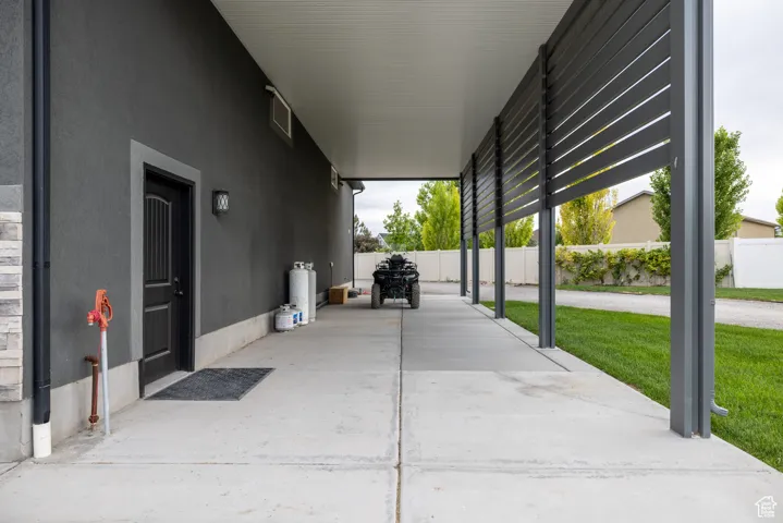 View of patio / terrace with a carport