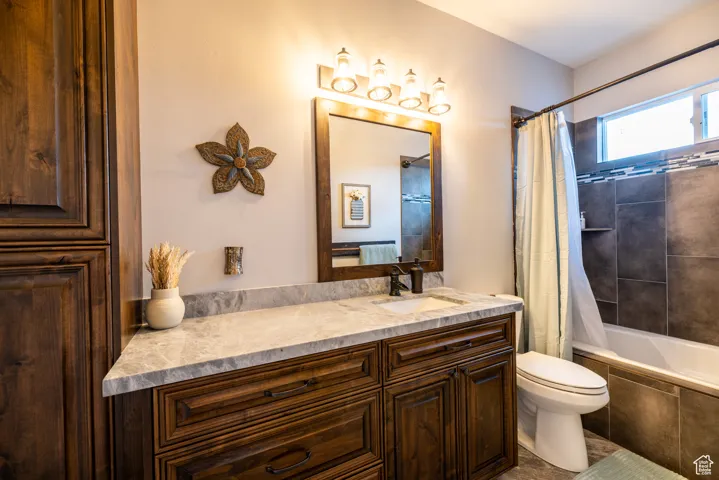 Bathroom featuring vanity and tiled shower / bath combo