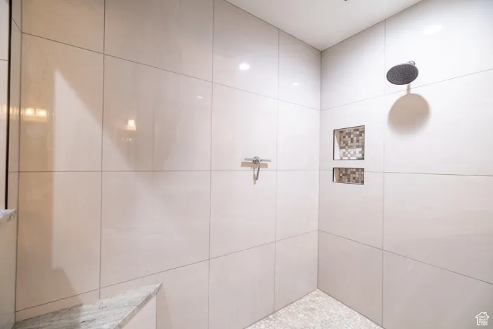 Full bath with a tile shower