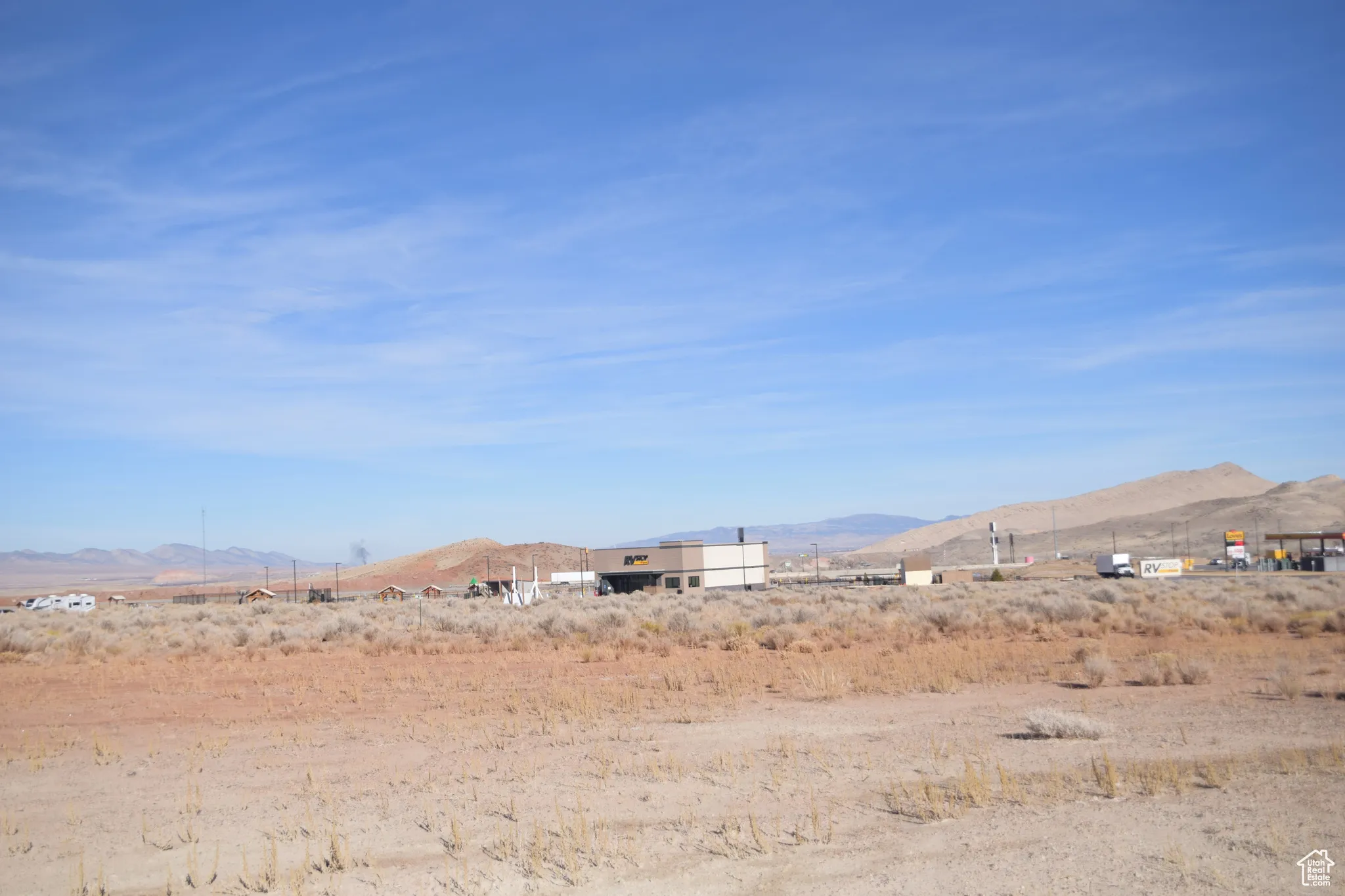 View of mountain backdrop with rural landscape