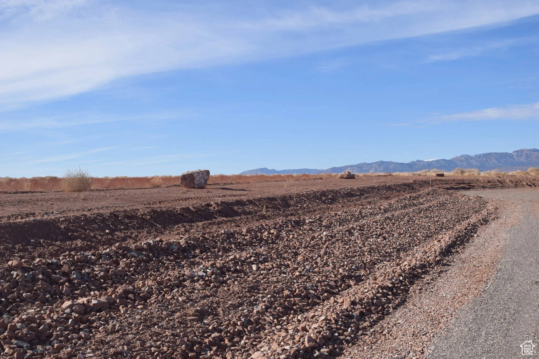 View of mountain backdrop with rural landscape