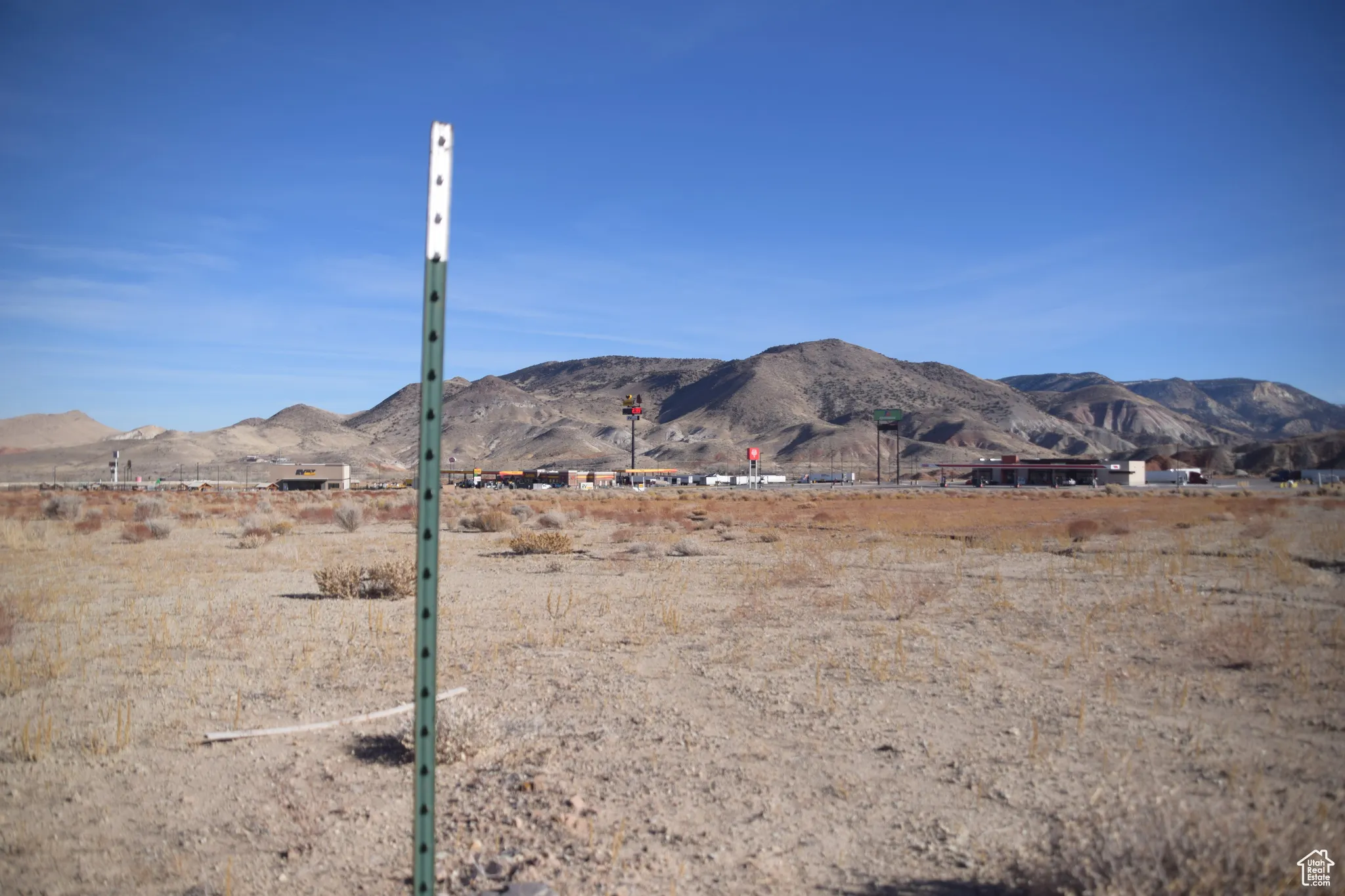 View of mountain backdrop featuring rural landscape