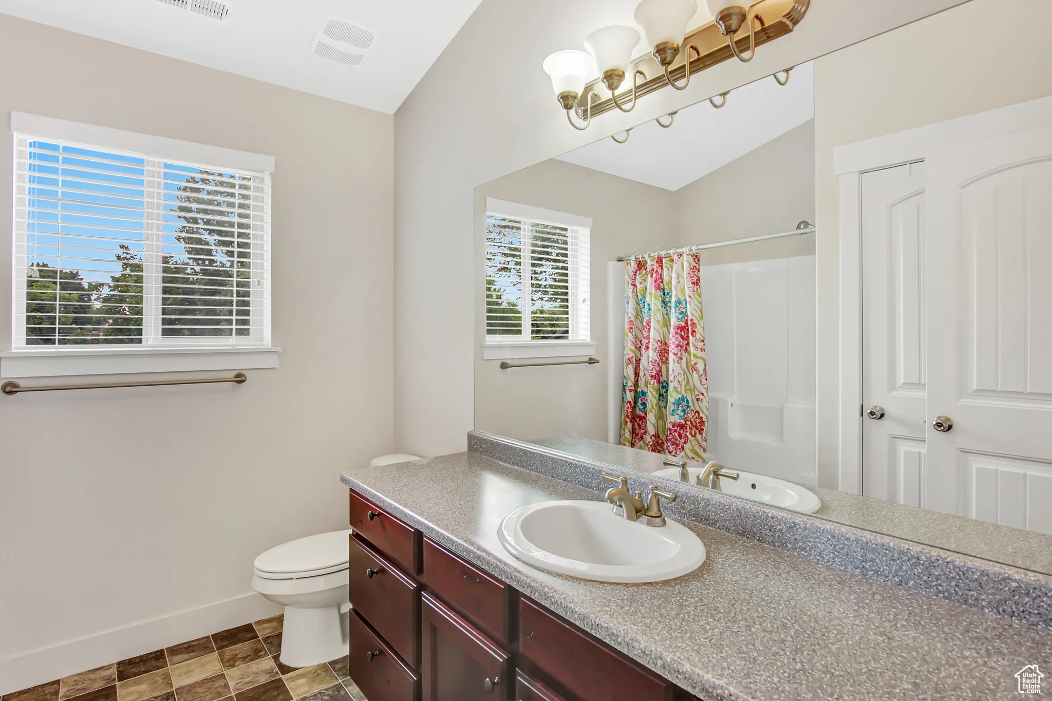 Full bath featuring vanity and a shower with curtain