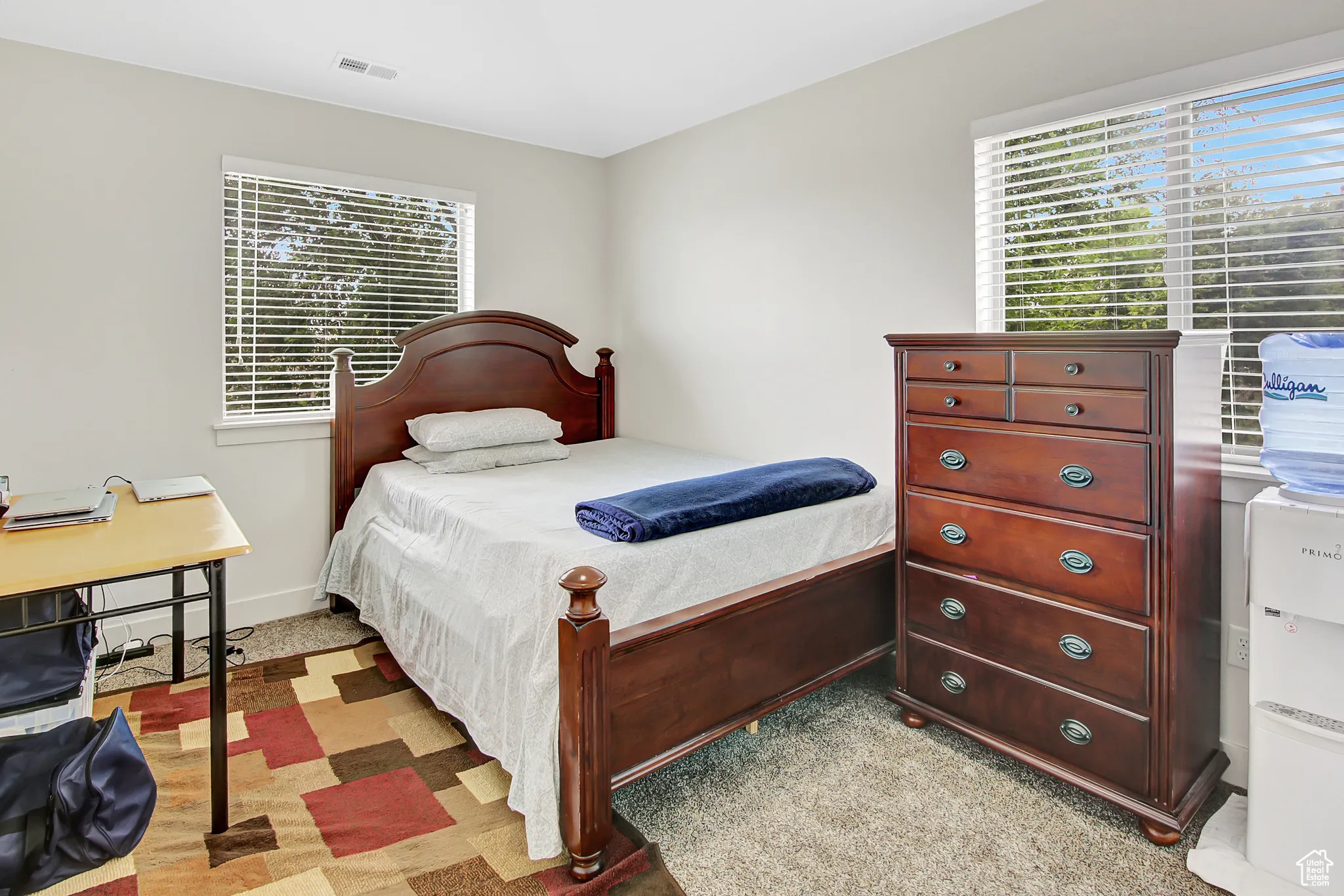 Bedroom with multiple windows