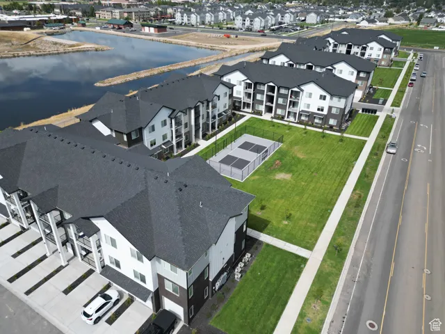 Aerial perspective of suburban area with a nearby body of water