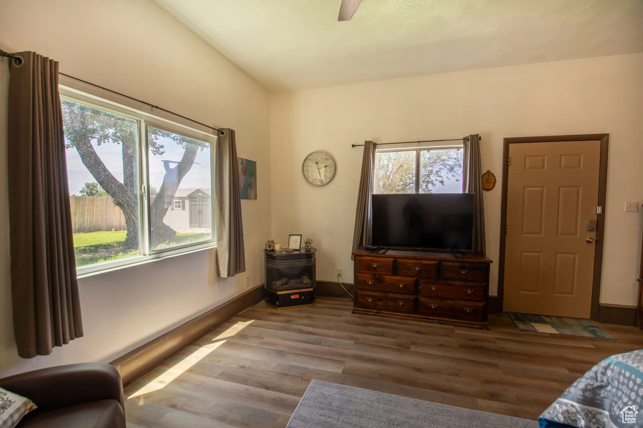 Living room with wood finished floors and baseboards