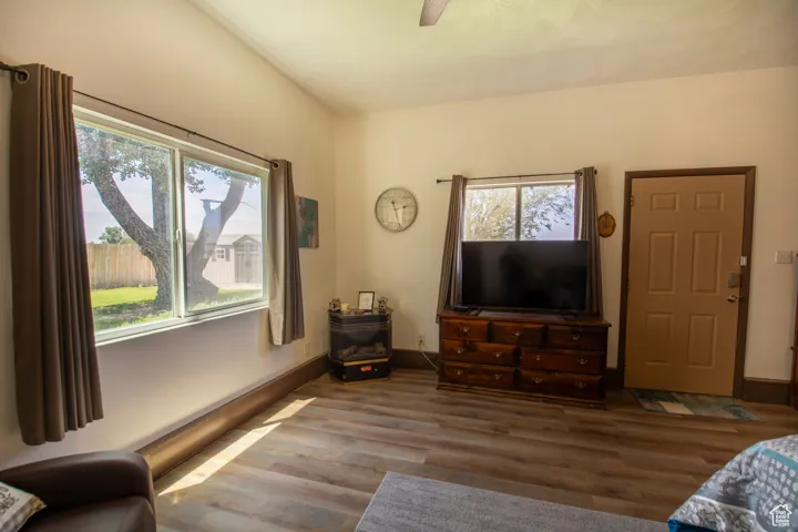 Living room with wood finished floors and baseboards