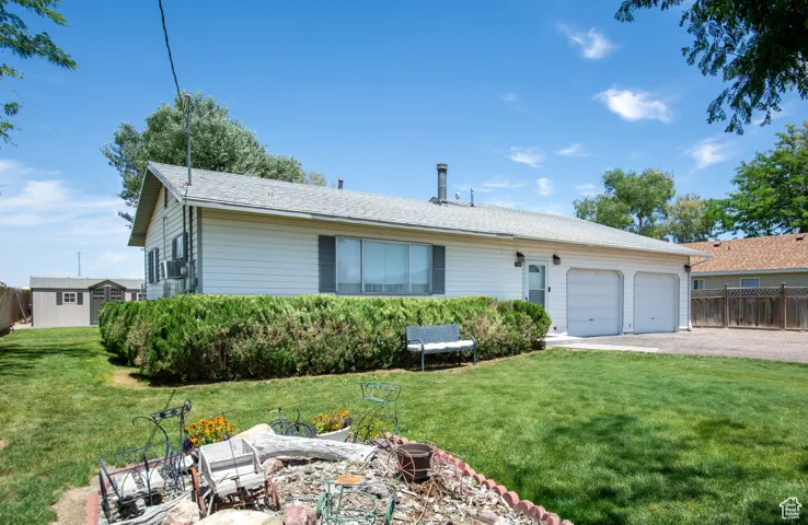 Single story home with an attached garage and driveway