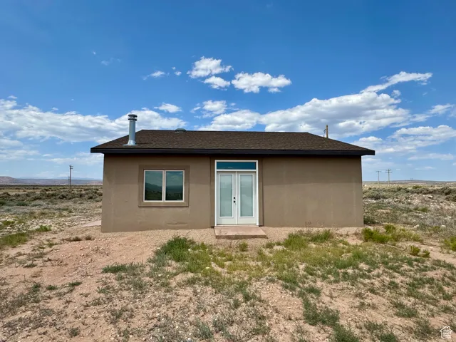 Back of house with stucco siding