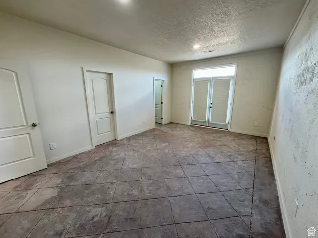 Spare room with a textured ceiling