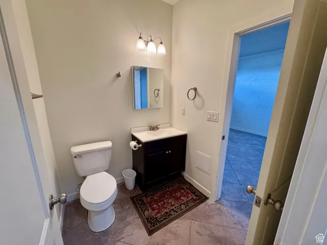 Bathroom with vanity and tile patterned flooring