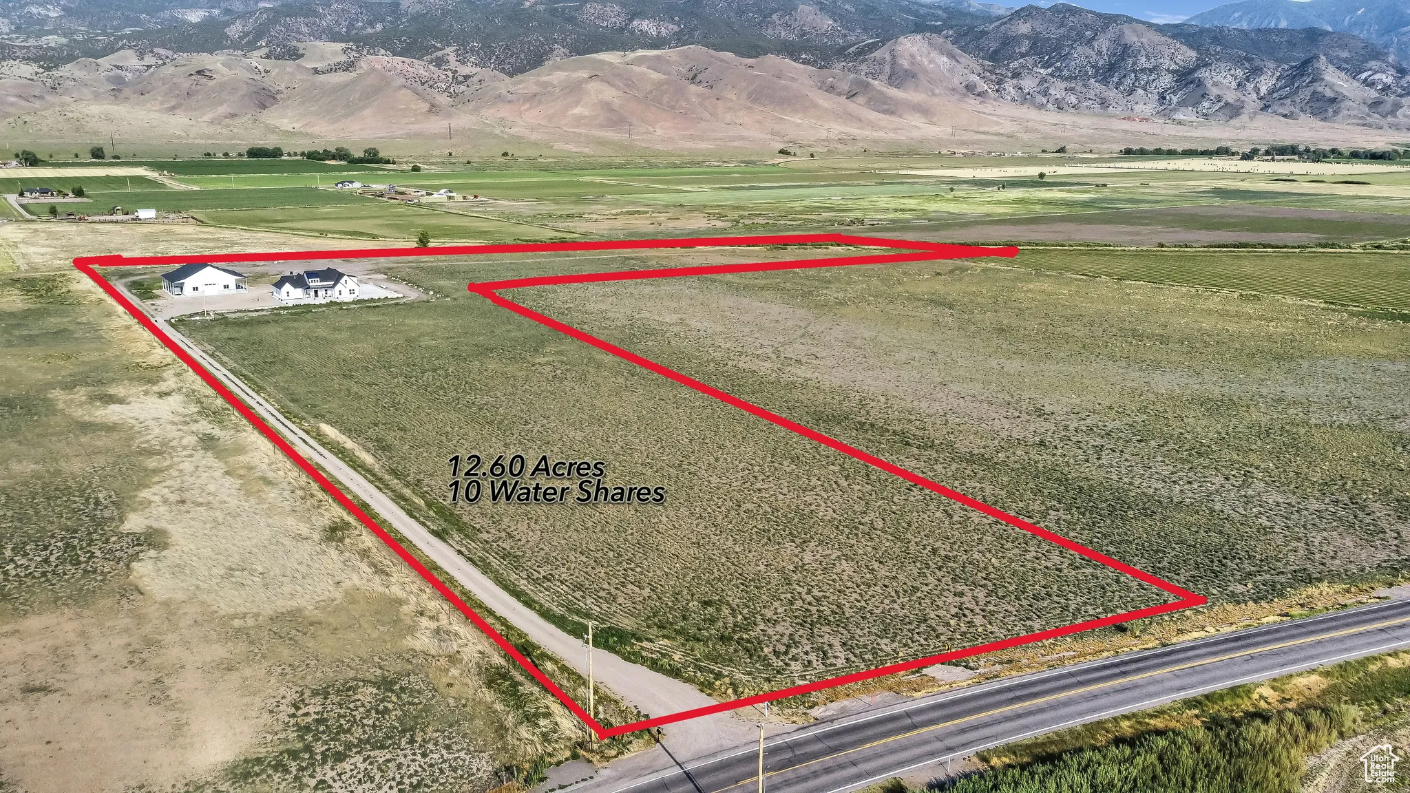 View of rural area with property boundaries highlighted and a mountain backdrop