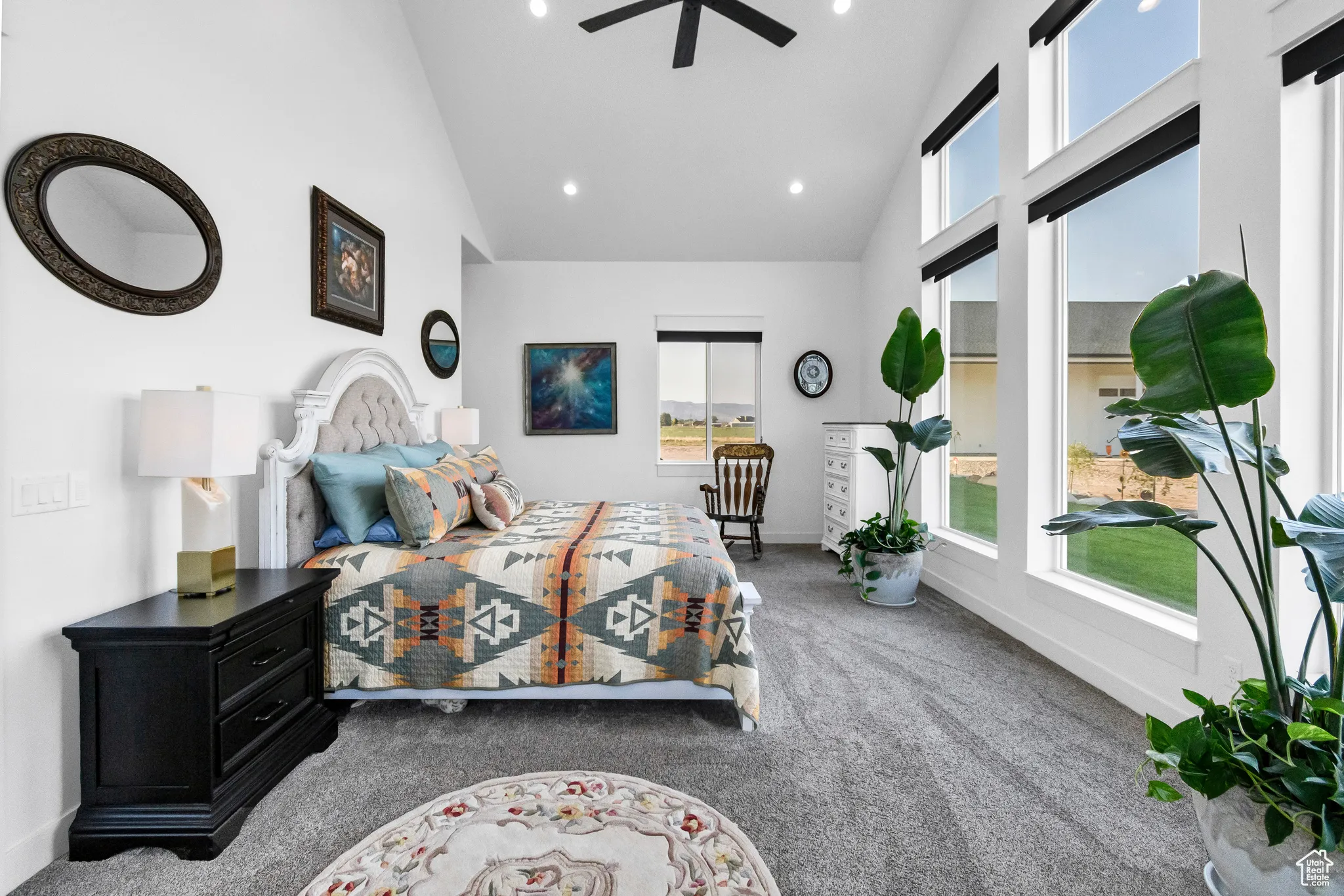 Bedroom featuring carpet flooring, multiple windows, high vaulted ceiling, recessed lighting, and a ceiling fan