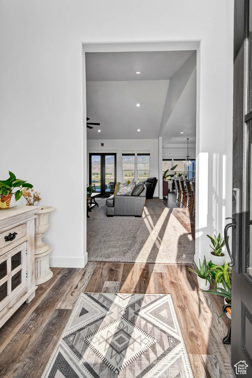 Hall featuring wood finished floors and recessed lighting