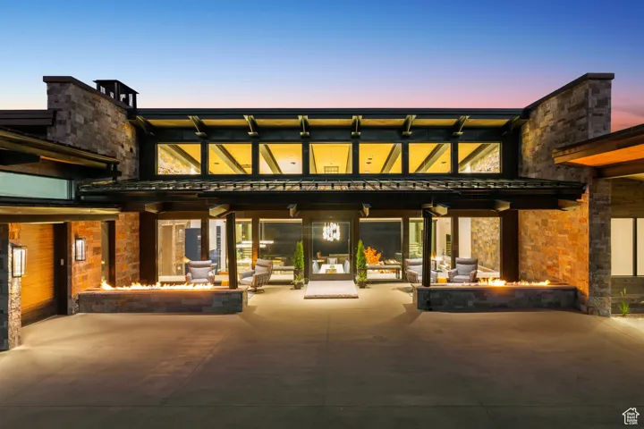 View of property with an outdoor fire pit