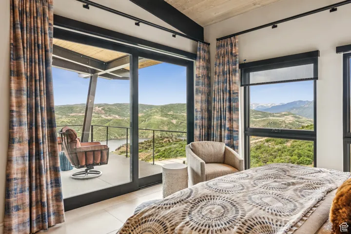 Tiled bedroom featuring a mountain view