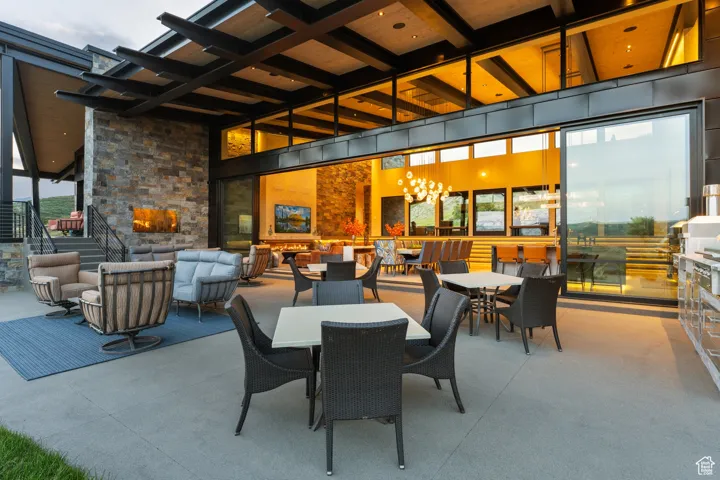 View of patio with an outdoor hangout area and outdoor dining area