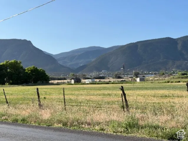 View of mountain backdrop with rural landscape