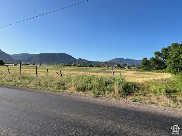View of mountain background featuring rural landscape