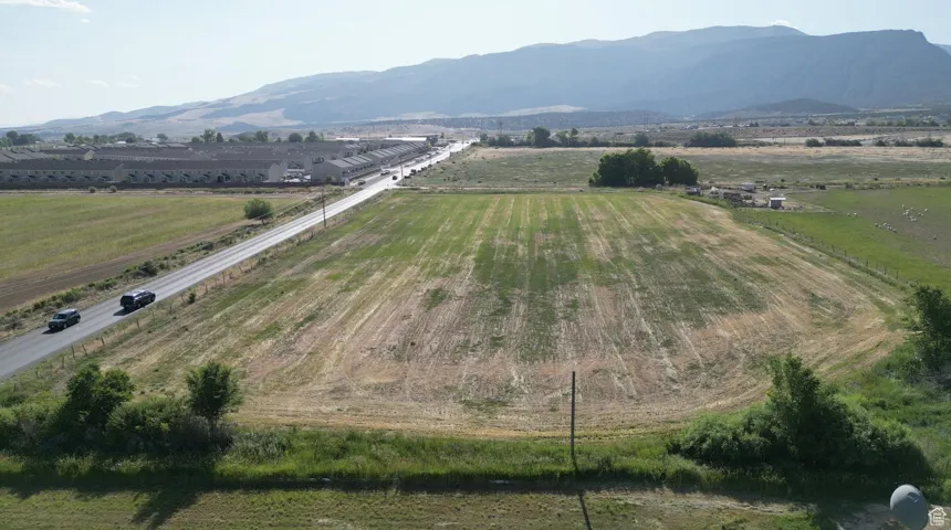Overview of rural landscape with mountains and large plots for crops