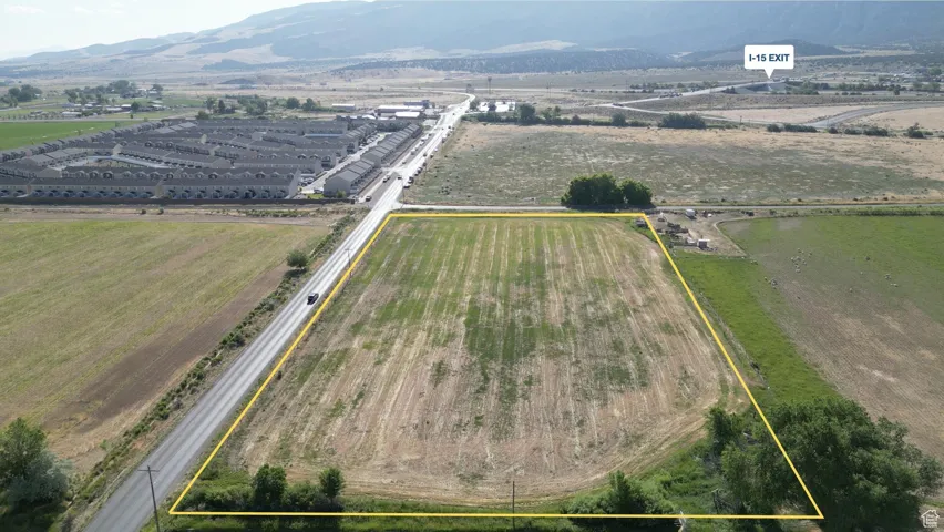 Overview of rural landscape featuring property parcel outlined and a mountain backdrop