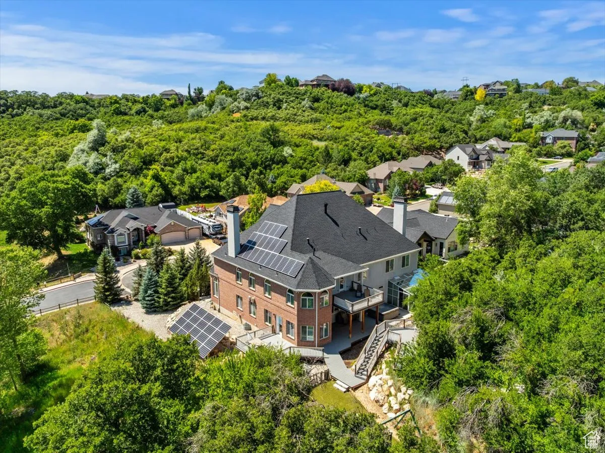 Aerial perspective of suburban area with a heavily wooded area
