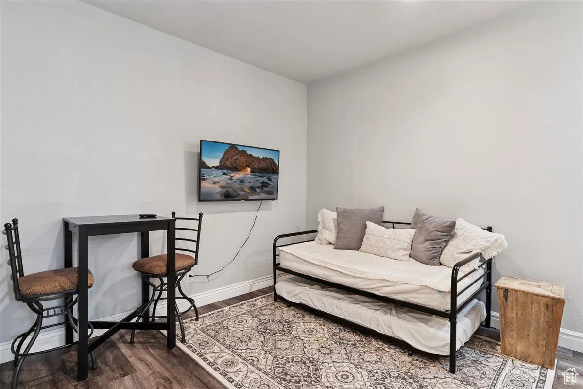 Living area featuring wood finished floors and baseboards