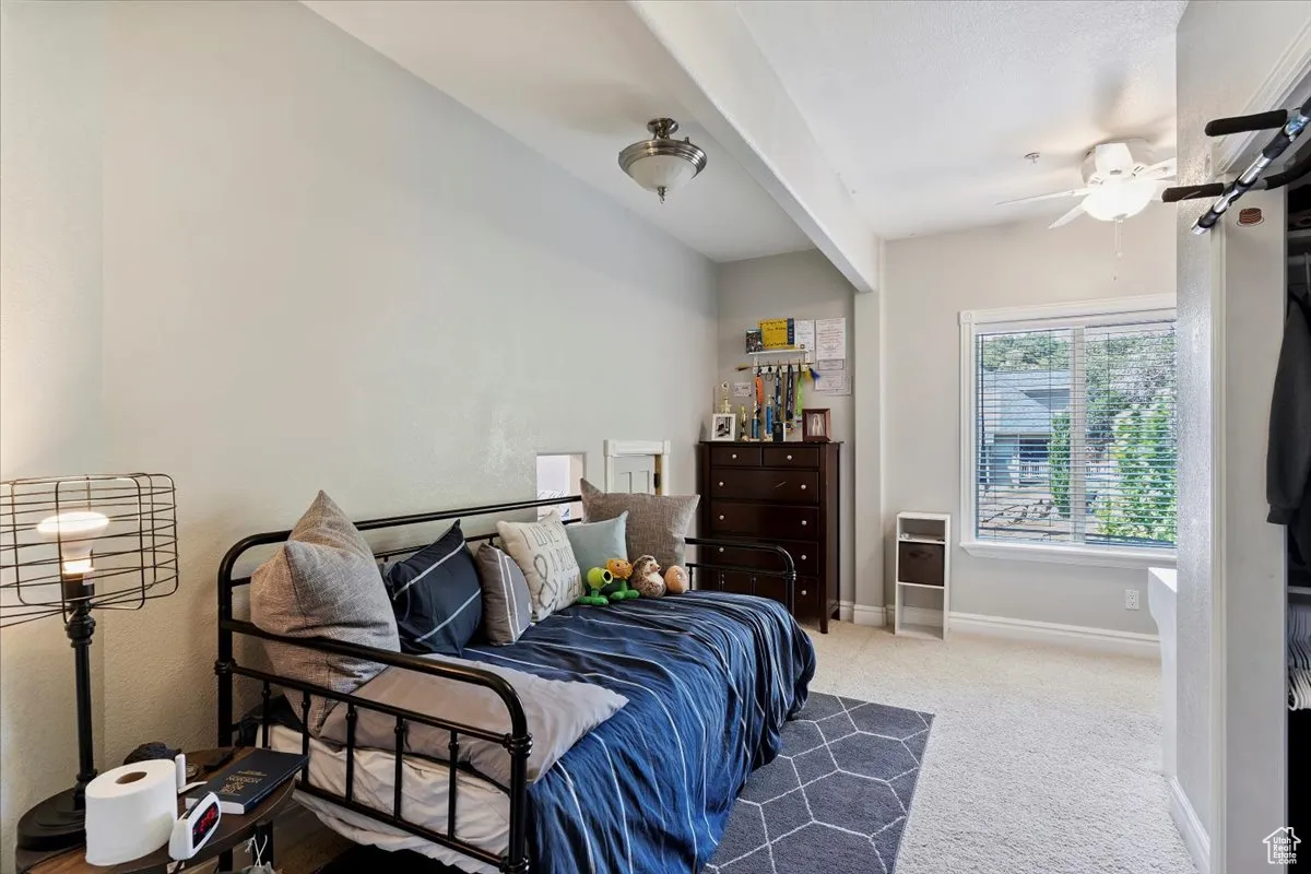 Bedroom with carpet and baseboards