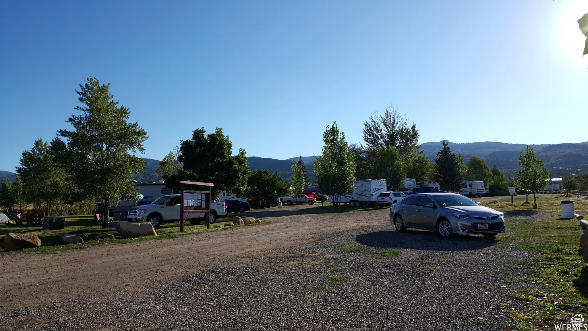 View of dirt / gravel road featuring a mountain view