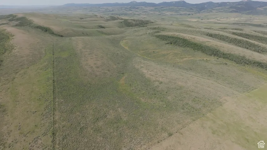View of property location featuring mountains and rural landscape