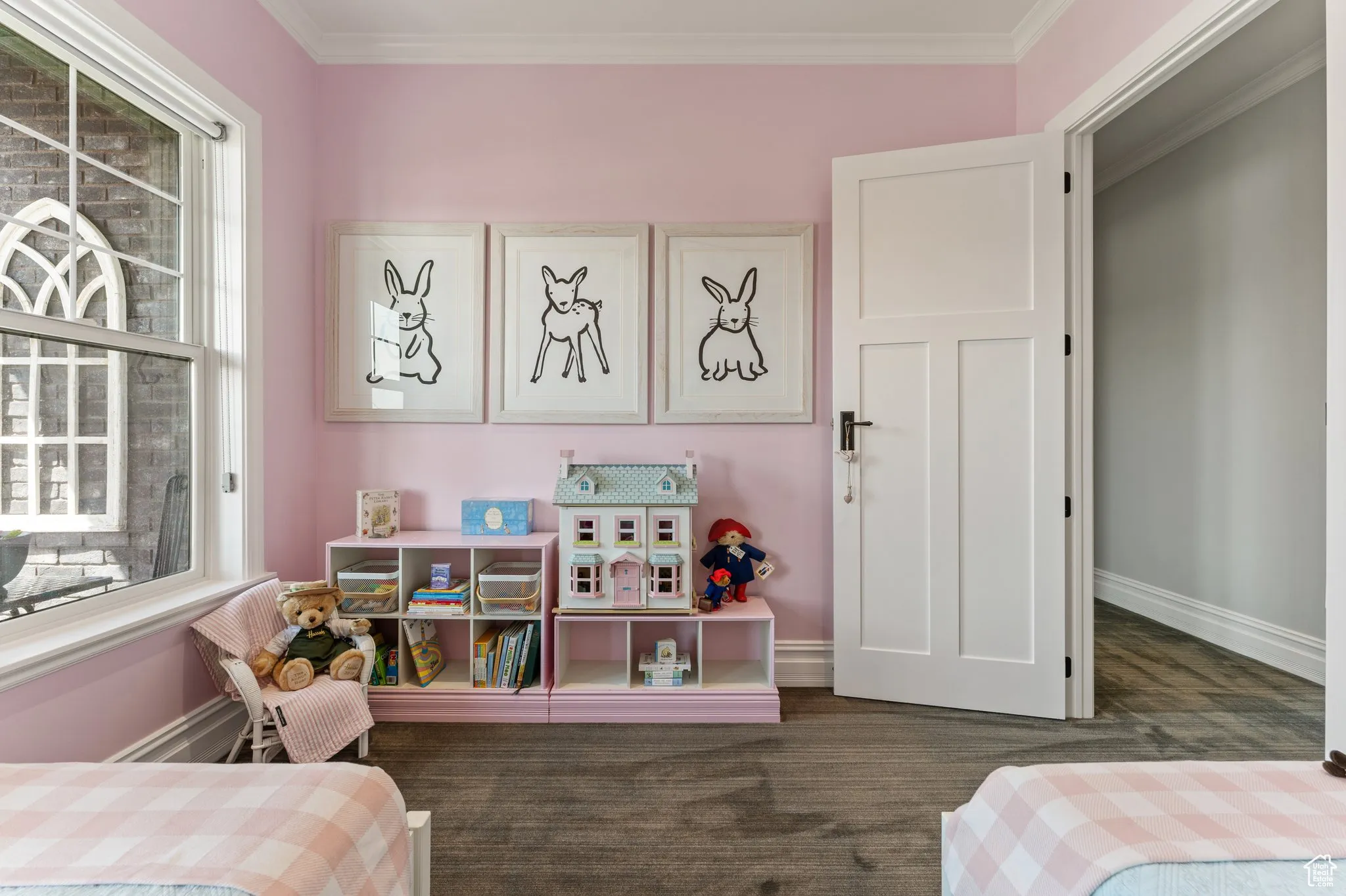 Bedroom with ornamental molding and wood finished floors
