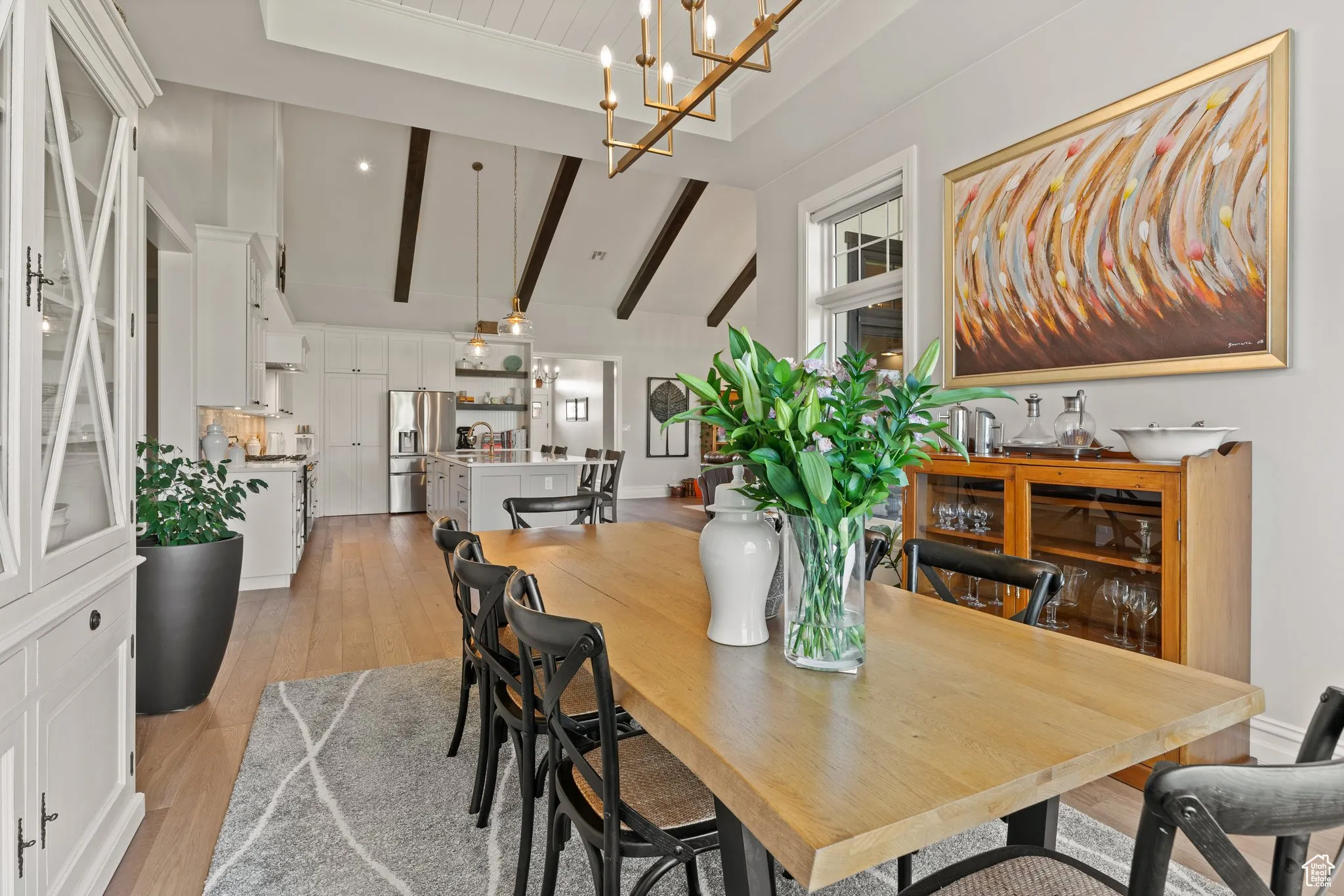 Dining space featuring light wood finished floors and a chandelier
