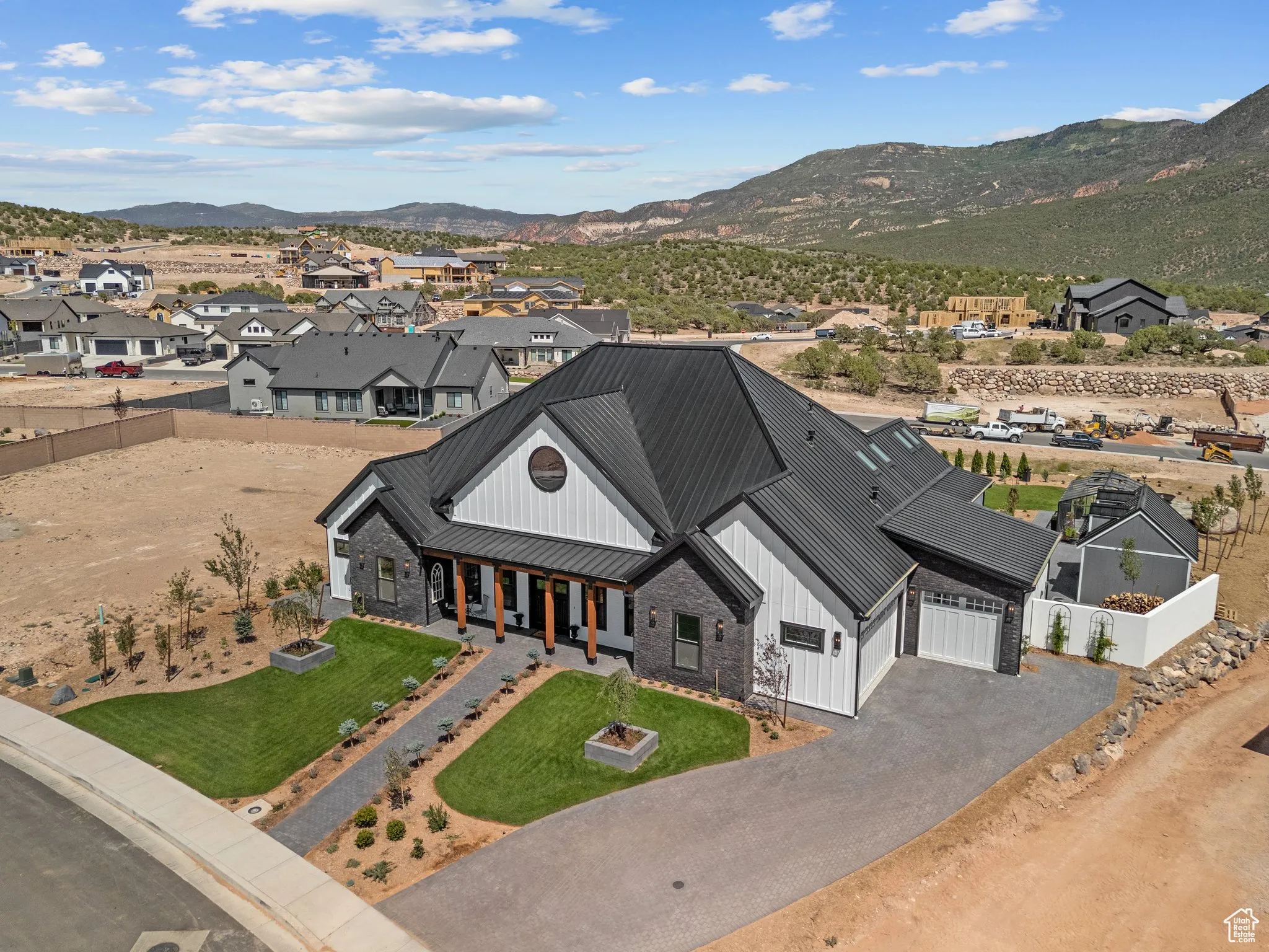 Aerial perspective of suburban area with a mountain backdrop