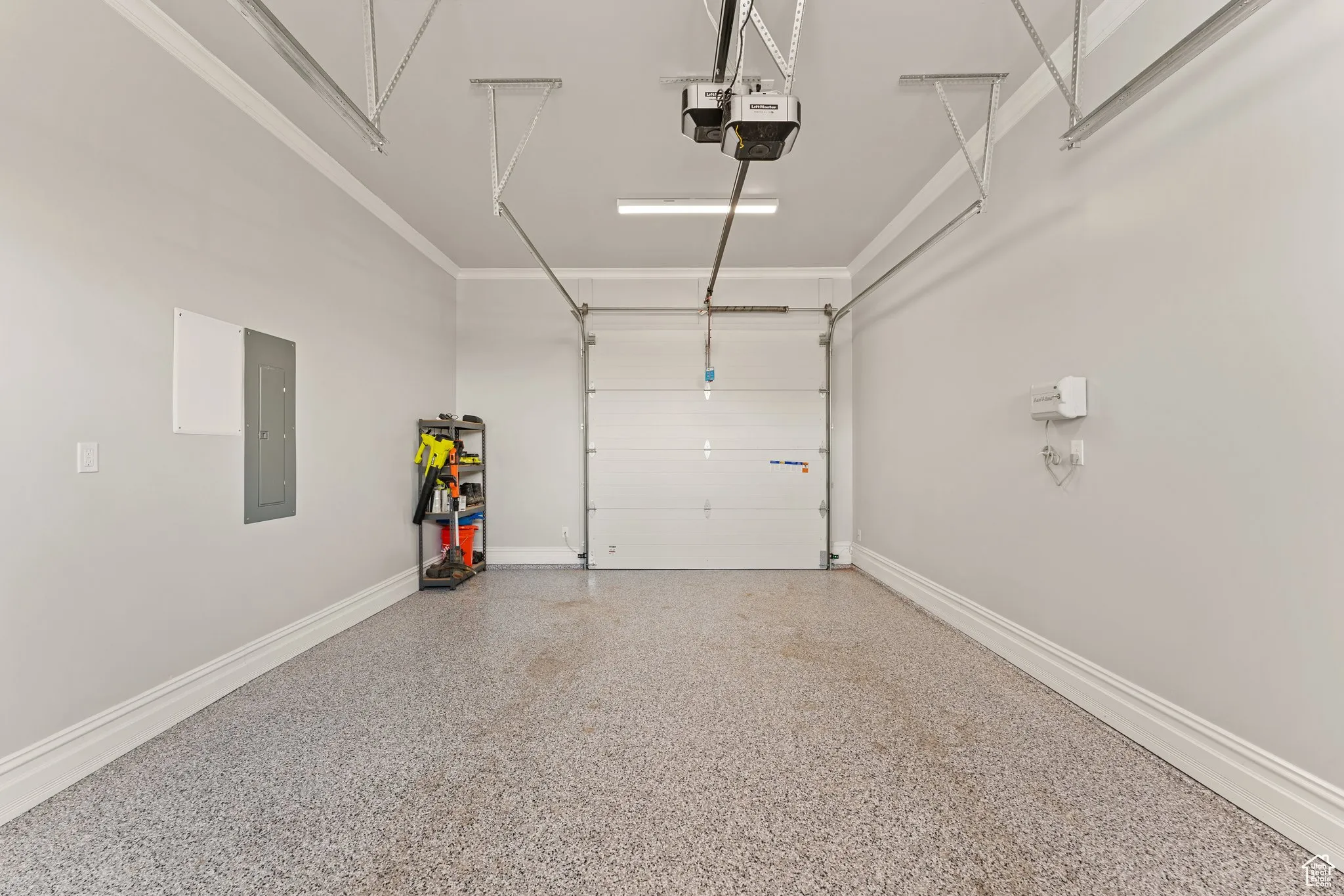 Garage with a garage door opener and electric panel