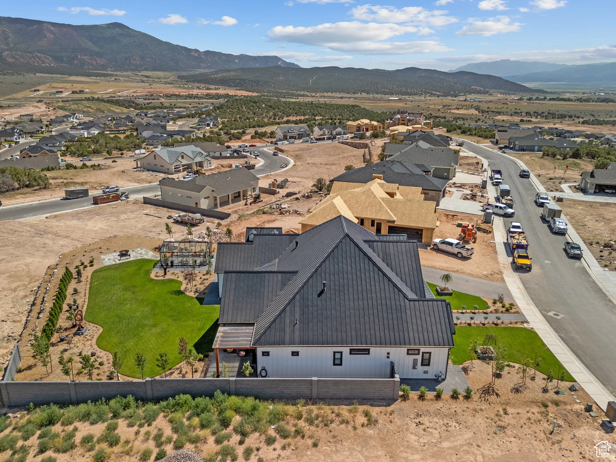 Aerial view of residential area featuring a mountainous background