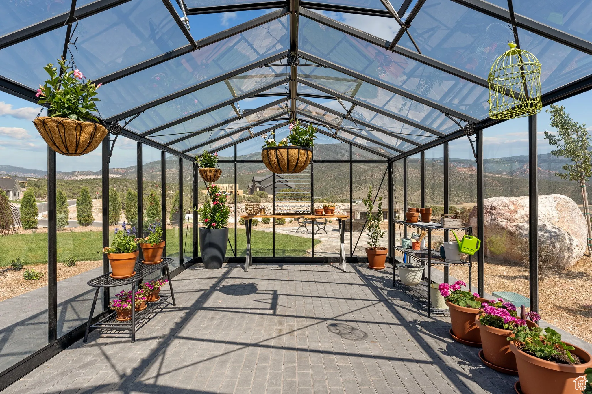 Unfurnished sunroom with healthy amount of natural light and a mountain view