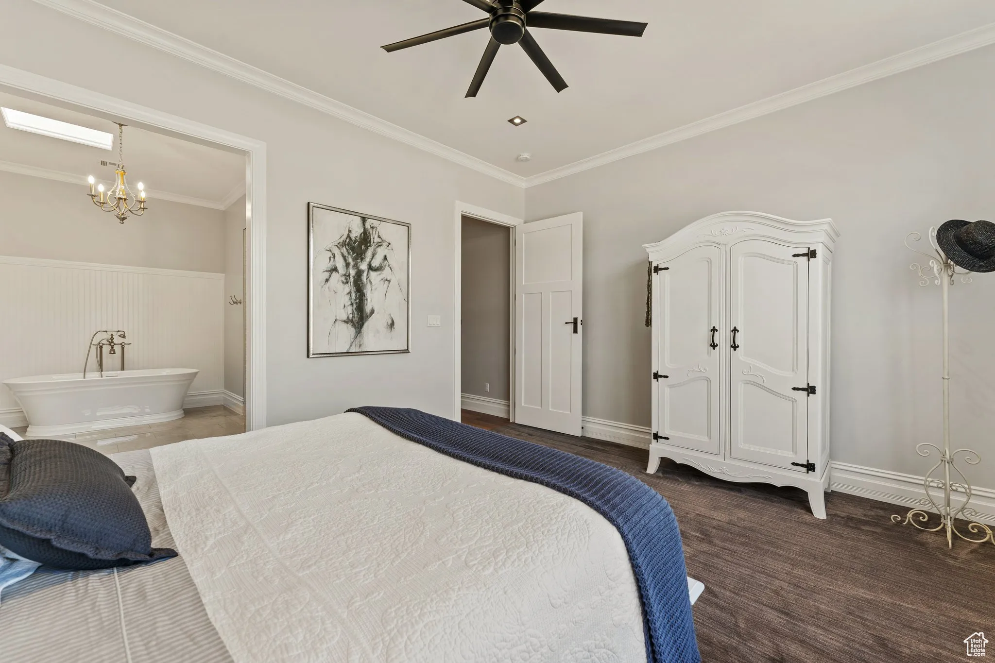 Bedroom with a chandelier, ornamental molding, connected bathroom, and ceiling fan