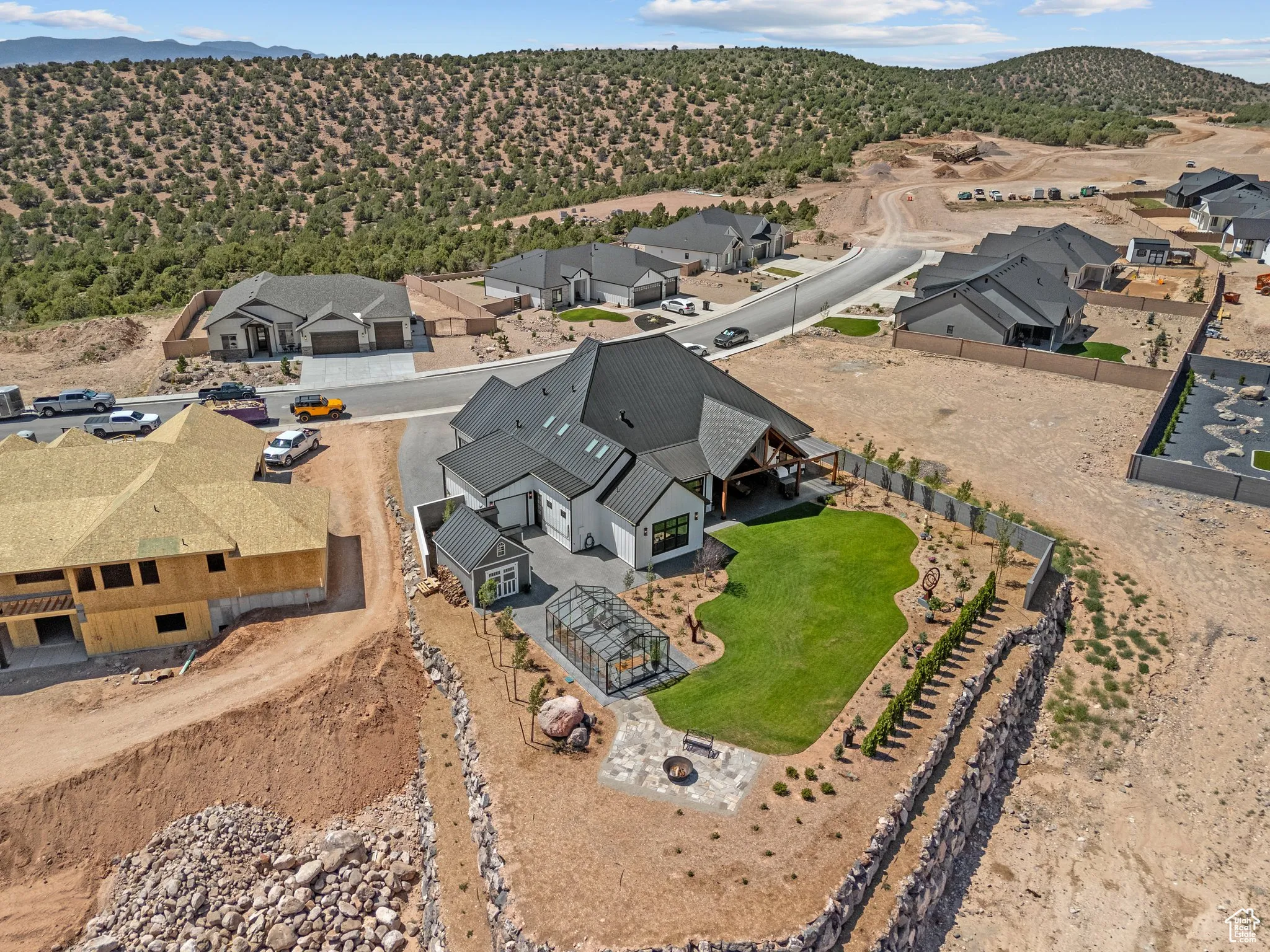 Aerial perspective of suburban area with a mountain backdrop