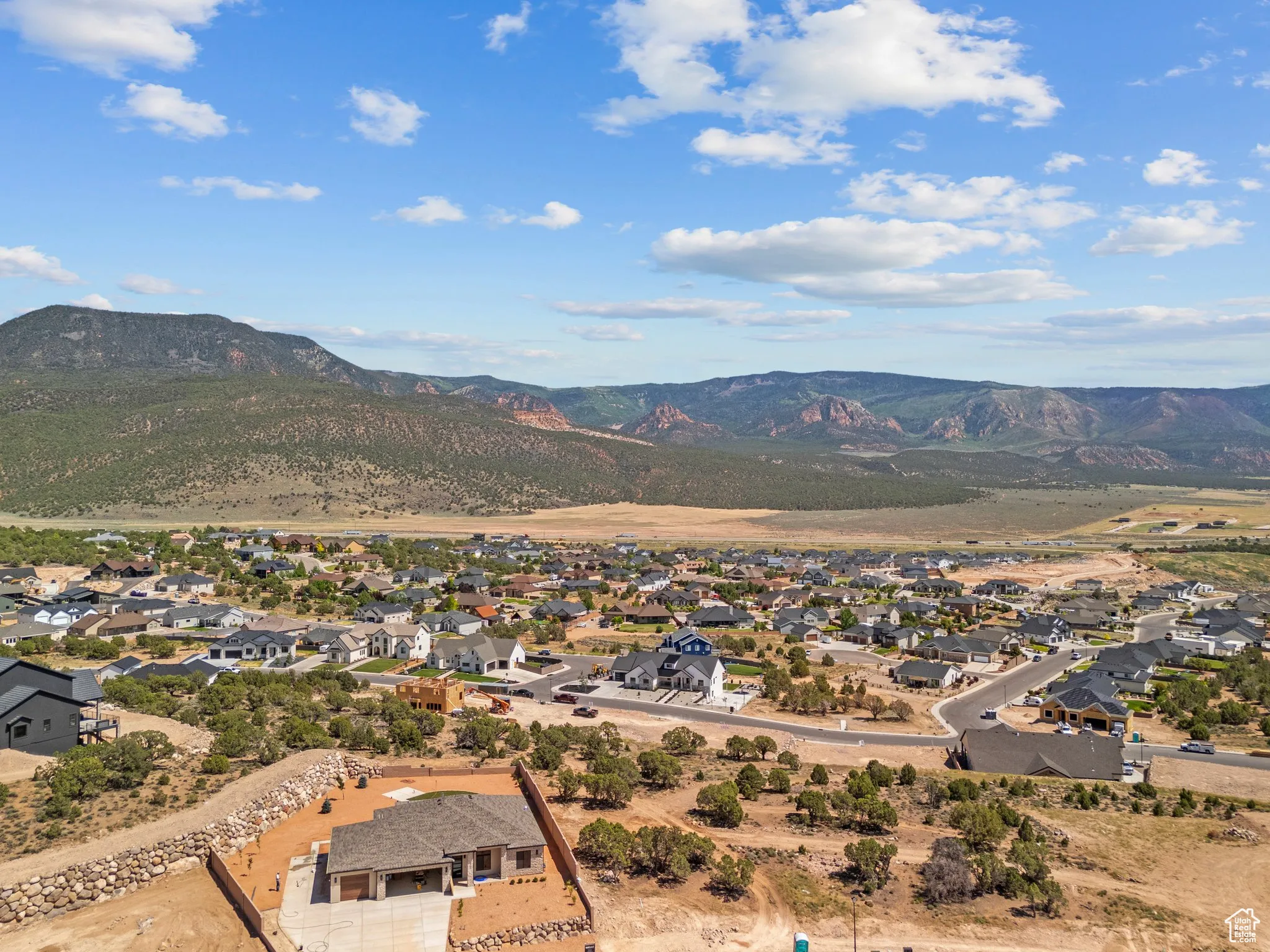 View of mountain background featuring nearby suburban area