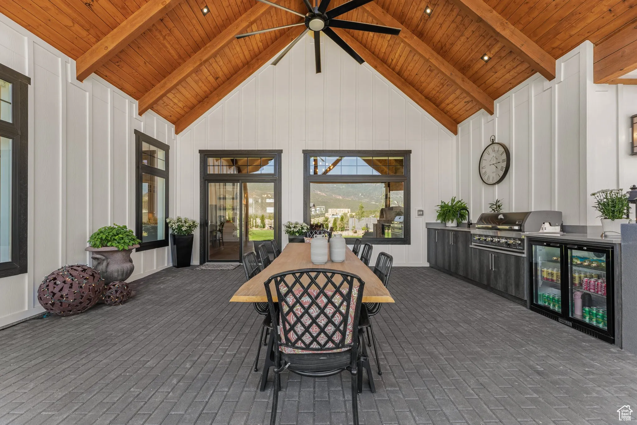 View of patio / terrace with area for grilling, ceiling fan, and outdoor dining space