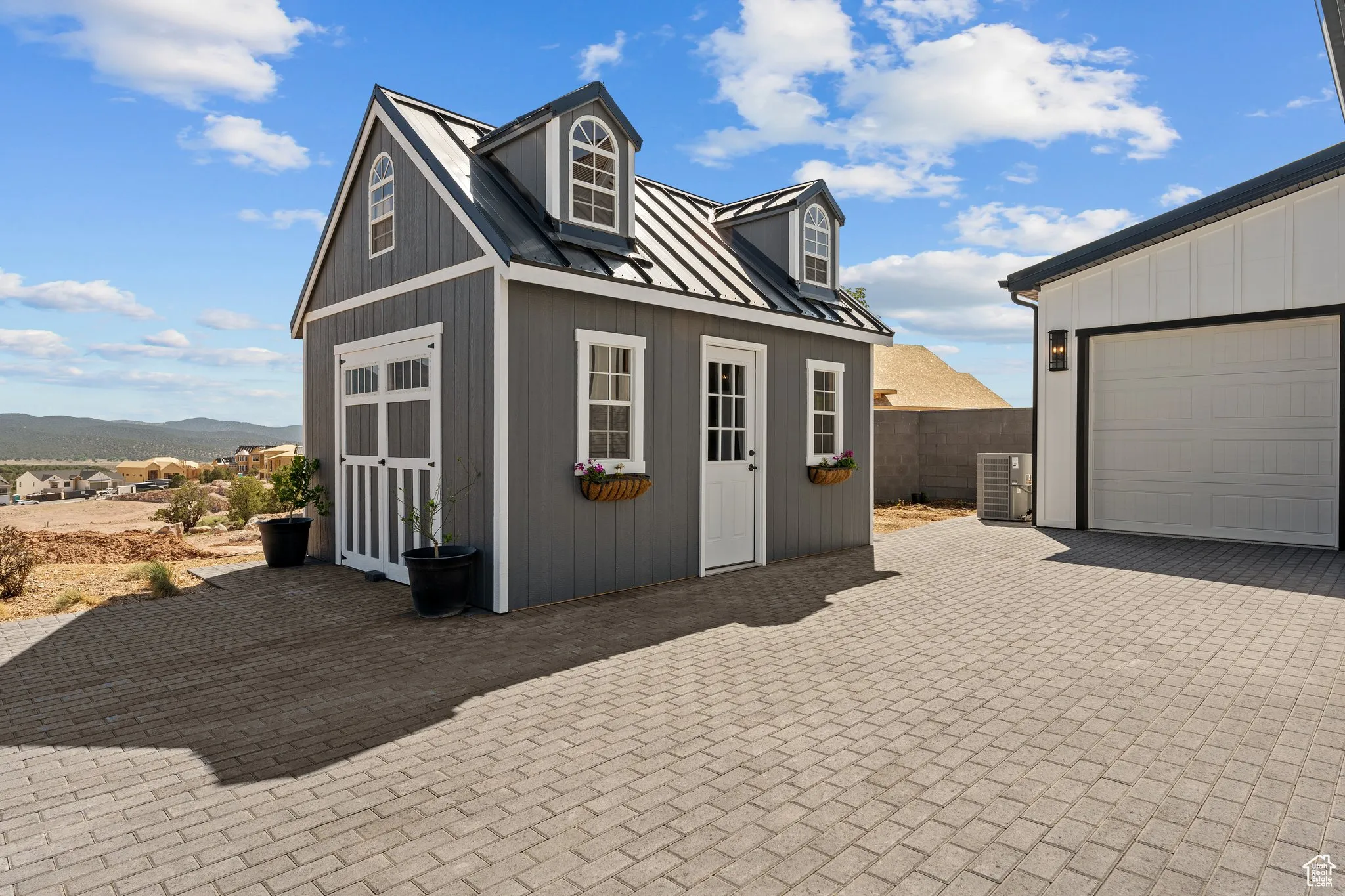 View of outdoor structure with a mountain view and a garage