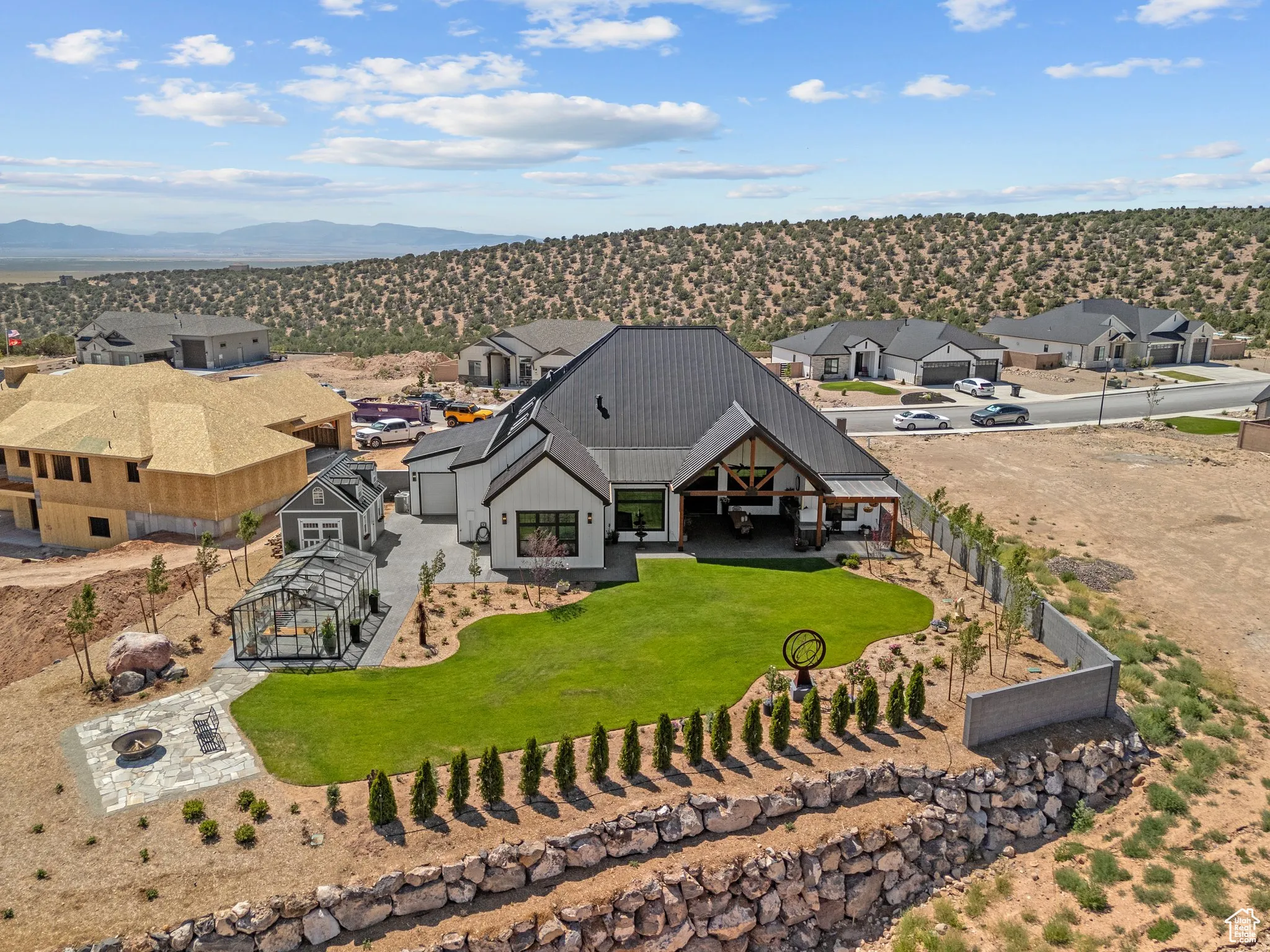 Aerial perspective of suburban area with a mountainous background