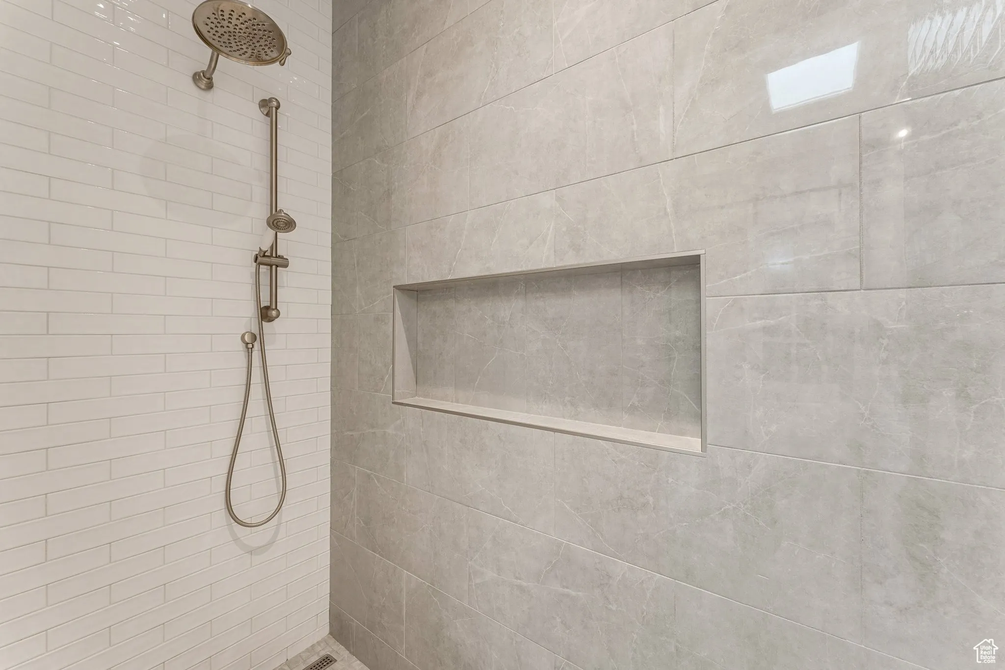 Bathroom featuring a tile shower