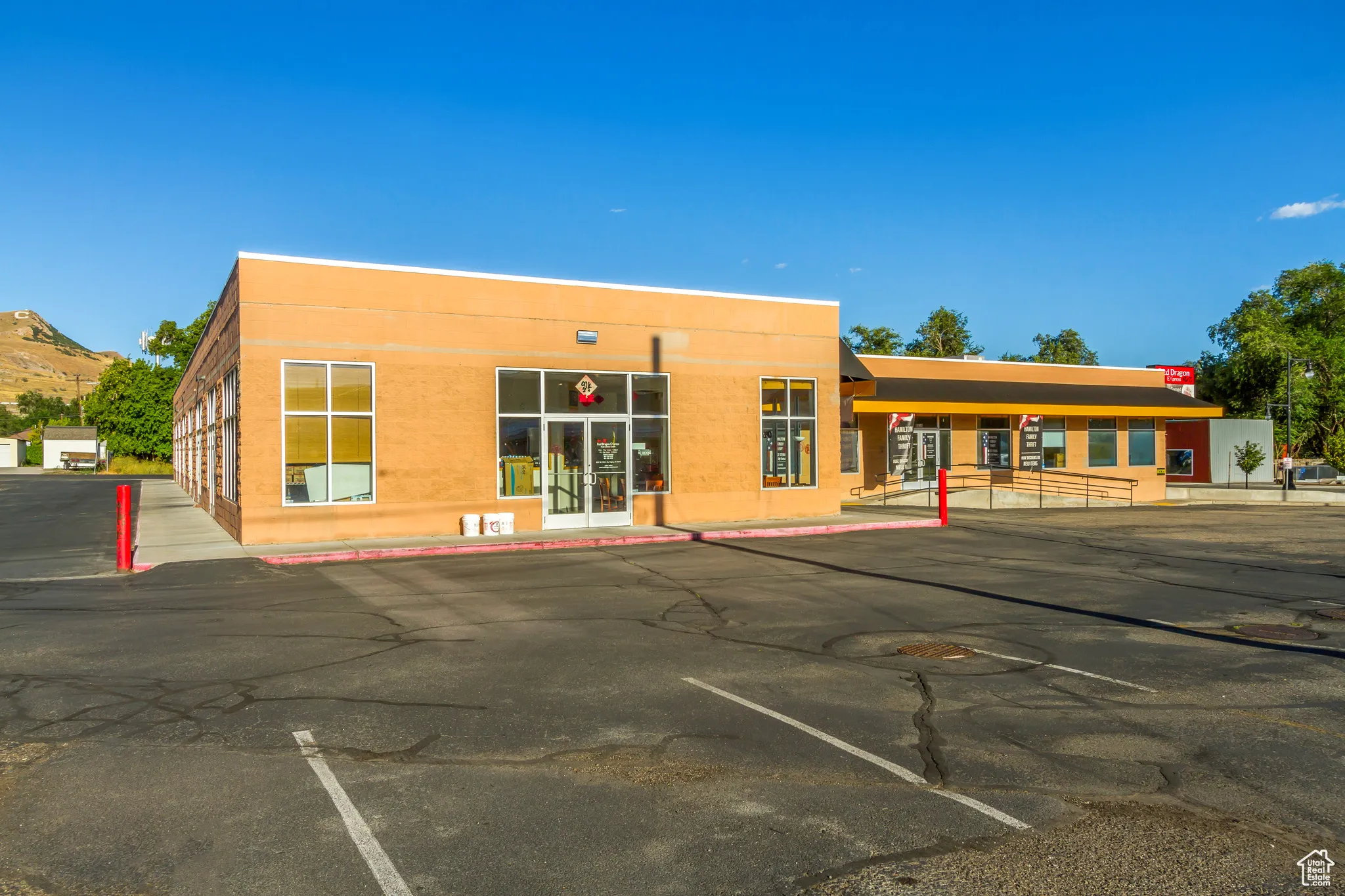 View of building exterior with uncovered parking