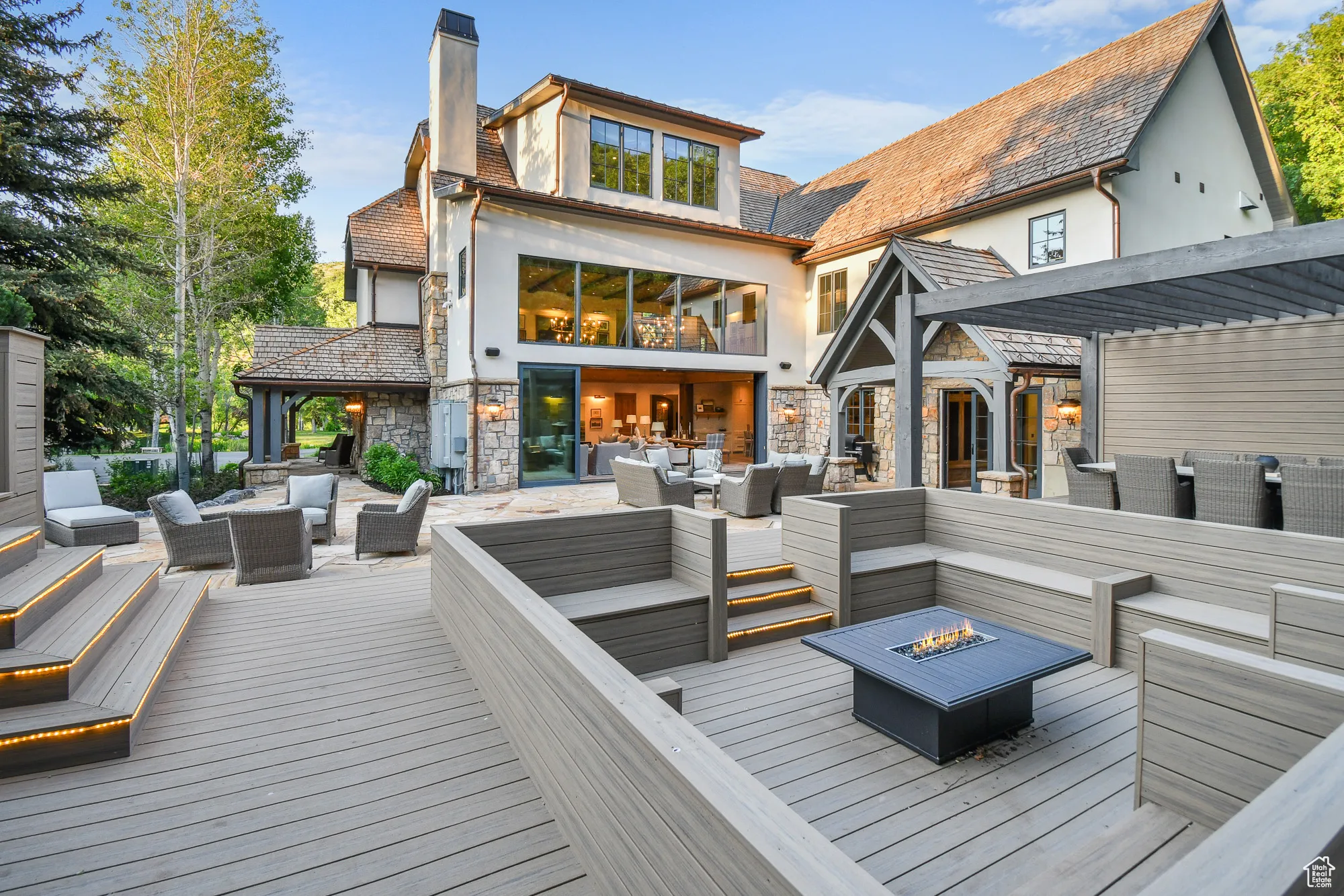 Large outdoor entertainment and dining area opens int the main floor living room.