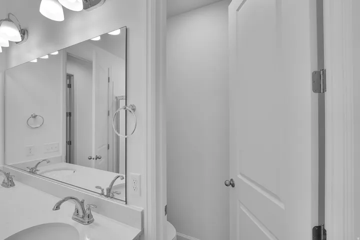 Bathroom with double vanity and toilet